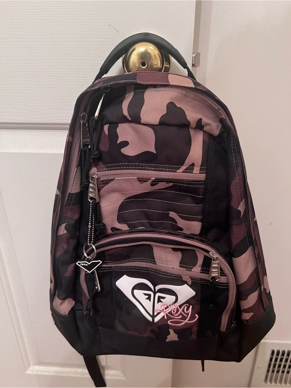 Roxy backpack with pink and black camouflage pattern.